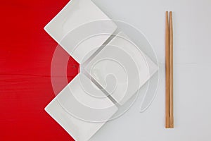 Ceramic bowls and bamboo chopsticks for sushi food