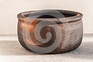 Ceramic or clay Turkish traditional pot on grey background. Guvec