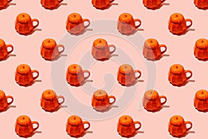 Ceramic Coffee tea soup cup as pumpkin on pink. Seamless pattern. Halloween concept, hard shadow, banner, printshop, flyer for