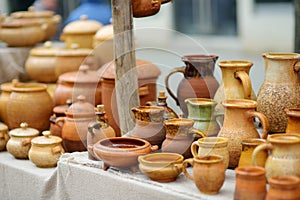 Ceramic dishes, tableware and jugs sold on Easter market in Vilnius. Lithuanian capital`s traditional crafts fair is held every