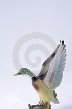 Ceramic duck taking flight