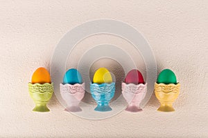 Ceramic egg-cups with colorful painted eggs