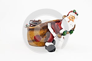 Ceramic figurine of Santa Claus with a big sack isolated