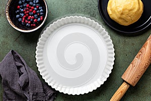 Ceramic form, pan for Cooking mixed berry crust pie or tart, mini tarts. Raw dough