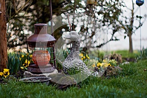 Ceramic goose in the flower garden