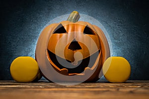 Ceramic Halloween pumpkin and gym dumbbells.