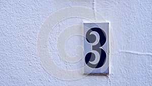 ceramic house number table. number: 3. on a white background