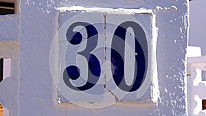 ceramic house number table. number: 30. on a white background