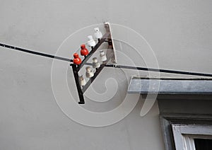 Ceramic insulator mounted on building