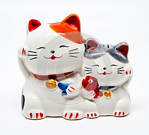 Ceramic Japanese welcoming Cats or lucky Cat ( Maneki Neko ).