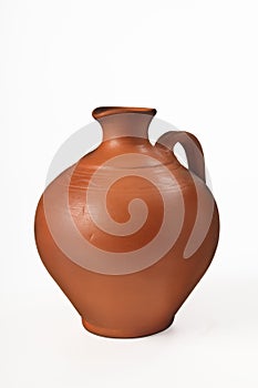 Ceramic jug for olive oil and wine on a white background. Isolated. Close-up.