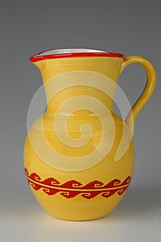 Ceramic jug in yellow and red