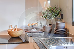 Ceramic kitchenware on the marble worktop