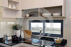 Ceramic kitchenware on the marble worktop