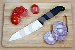 Ceramic knive on a chopping board