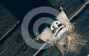 Ceramic mask on the wooden background