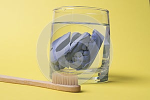 Ceramic model of human teeth in a glass