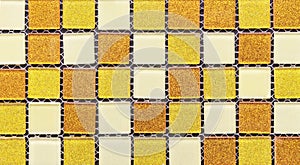 Ceramic mosaic tiles with orange, yellow and white squares to decorate the kitchen, bathroom or pool