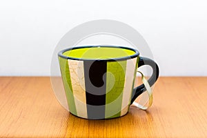 Ceramic cup with stripes photo