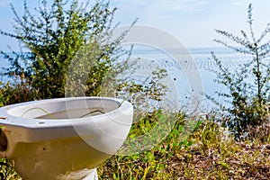 Outhouse toilet concept, bowl is placed in the forest above seas