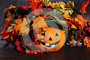 Ceramic Orange Halloween Pumpkin with Artificial Colorful Leaves