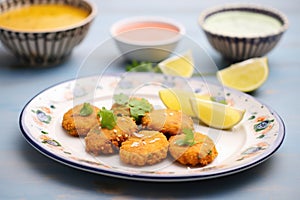 ceramic plate with masoor dal patties, side view