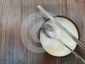 Ceramic plate with spoon and chopstick