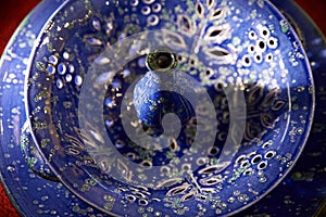 Ceramic plate with a teapot is made in the Asian style