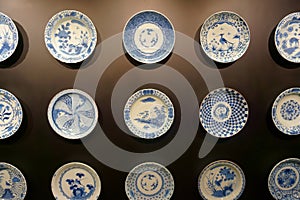 Ceramic plates on the dark wall