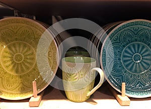 Ceramic plates with pattern on a shelf in a store