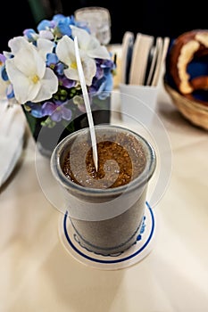 Ceramic pot with sweet mustard accompaniment to Bavarian white sausages photo