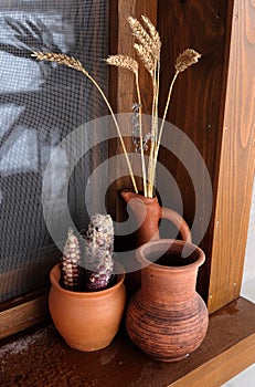 Ceramic pots on the windowsill