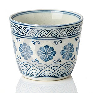 Ceramic sake cup with blue pattern isolated on white background