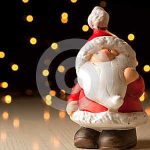 Ceramic Santa Claus on a bokeh background