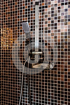 Ceramic shower tiles cabin with metal head in modern bathroom