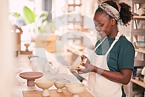 Ceramic store, creative pottery and black woman working on sculpture design mold, manufacturing or art product