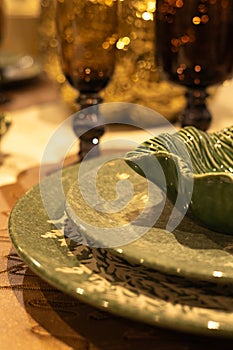 Ceramic tableware on the table in a restaurant. Selective focus.