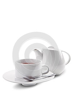 Tea cup and pot with Dilmah tea isolated on white