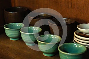 ceramic tea cups on the shelf