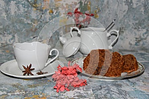 Ceramic tea set and plate with fruit cakes