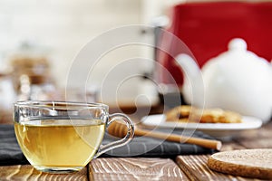 Ceramic teapot and toaster, kitchen table close up