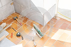 Ceramic tile installation site with its tools