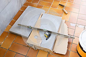 Ceramic tile installation site with its tools