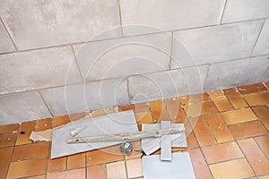 Ceramic tile installation site with its tools