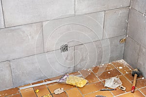 Ceramic tile installation site with its tools
