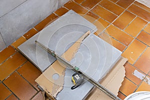 Ceramic tile installation site with its tools