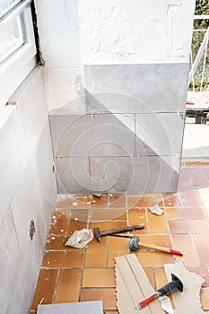 Ceramic tile installation site with its tools
