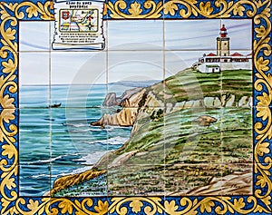 Ceramic tile in Lisbon street with image of Cabo da Roca Lighthouse, Portugal. Most western point of Europe mainland.