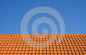 Ceramic tile roof against a blue sky