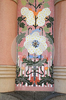 Ceramic tiled detail on pillar of building in Barcelona, Spain